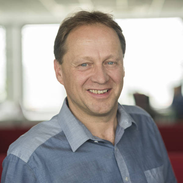 Portrait of an employee in controlling of the company WAREMA in blue shirt