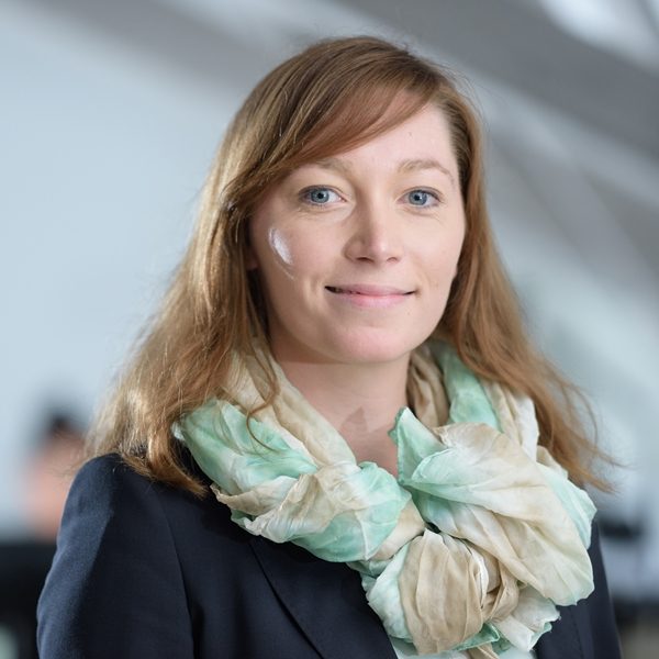 Portrait of a female employee of Franken Guss GmbH wearing a blue scarf in Kitzingen, Germany