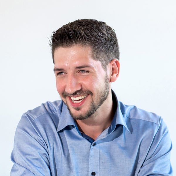 laughing portrait of a department manager in blue shirt of the company Preh GmbH in Bad Neustadt