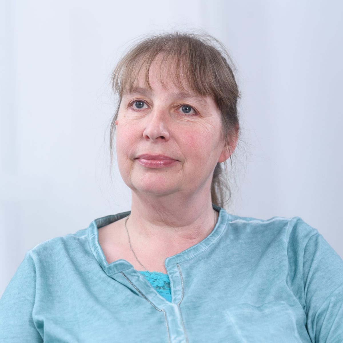 Portrait of a female employee in blue shirt of SKZ Kunststoff-Zentrum in Würzburg